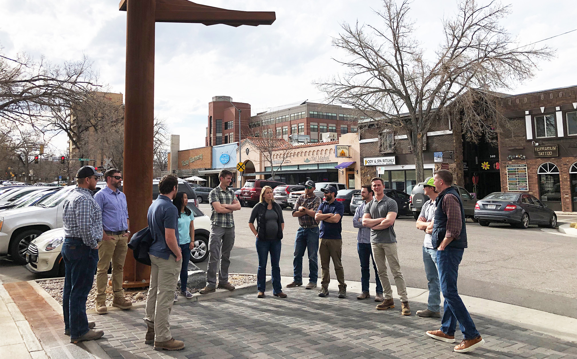 Team taking a tour of newly renovated alley in Fort Collins, Colorado.