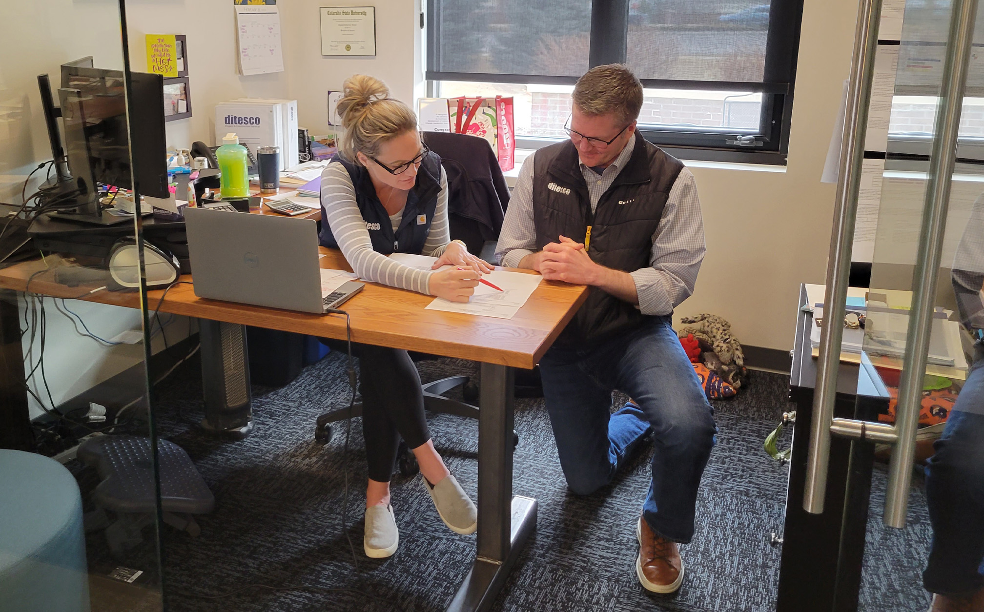 Man and woman collaborating in office